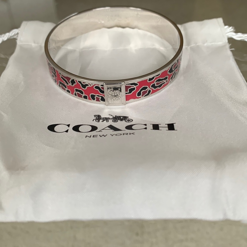 COACH floral bangle bracelet. Silver with pink , black and red. NEW- never worn.